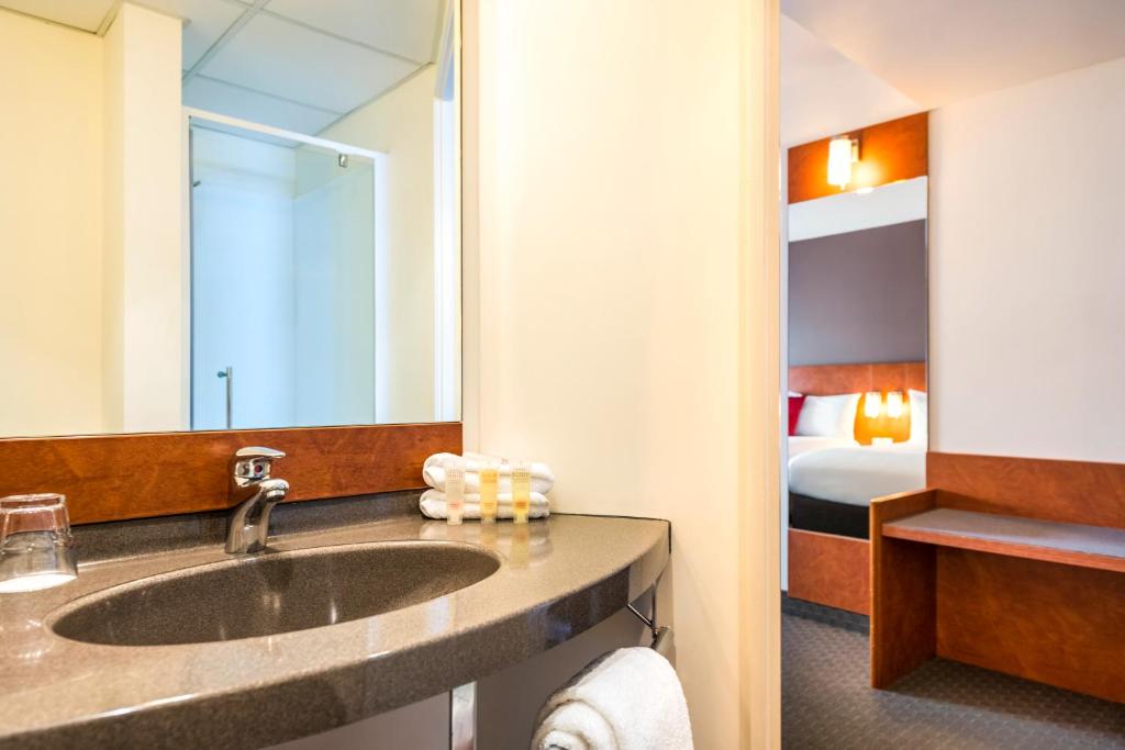 Postel nebo postele na pokoji v ubytování Ibis Christchurch