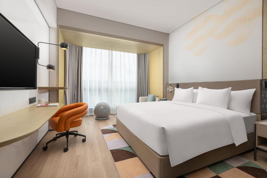 Postel nebo postele na pokoji v ubytování EVEN Hotel Shanghai Hongqiao CBD by IHG