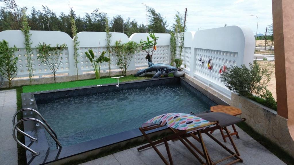 Bazén v ubytování CoCo Villa Quy Nhon - Venuestay nebo v jeho okolí