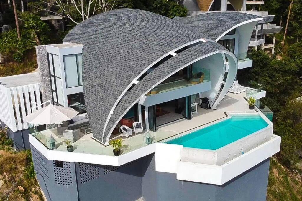 an aerial view of a house with a swimming pool at Seaview Dreamscape Villa in Amphoe Koh Samui