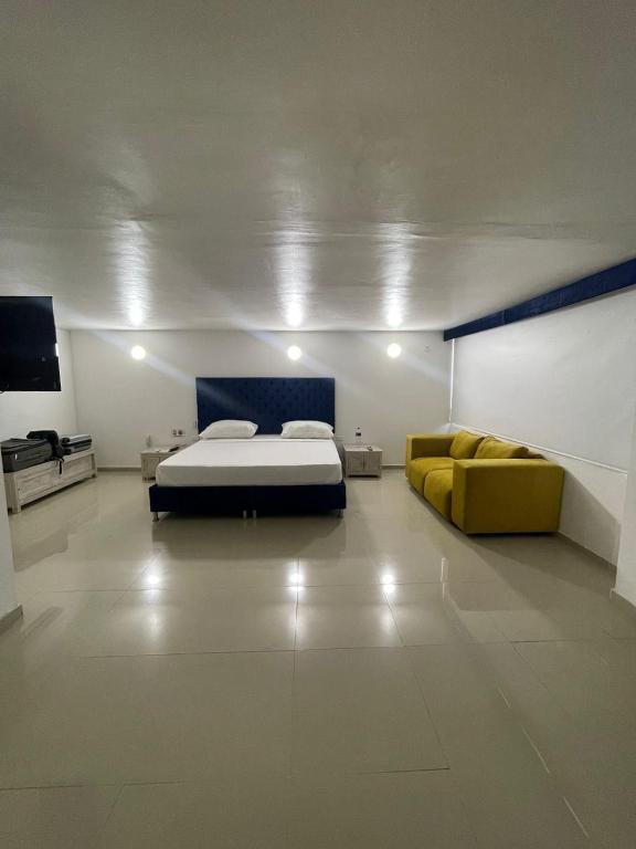Postel nebo postele na pokoji v ubytování Hotel Hernández CTG