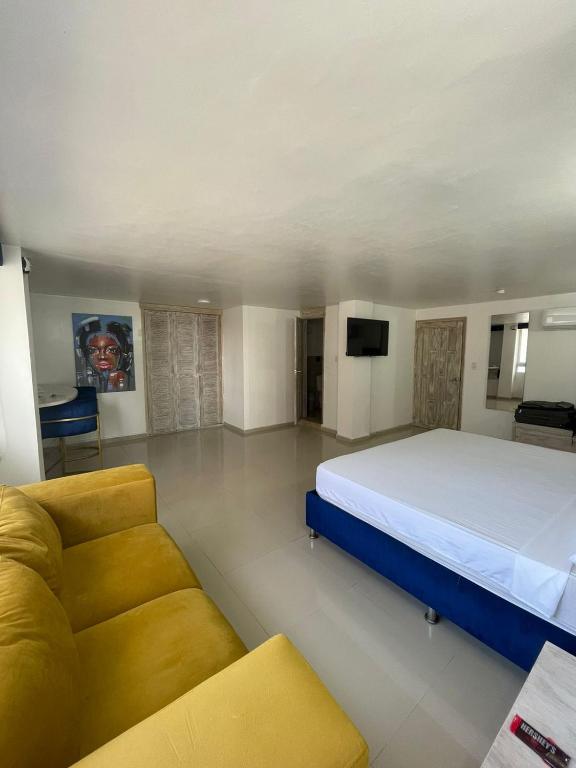 Postel nebo postele na pokoji v ubytování Hotel Hernández CTG