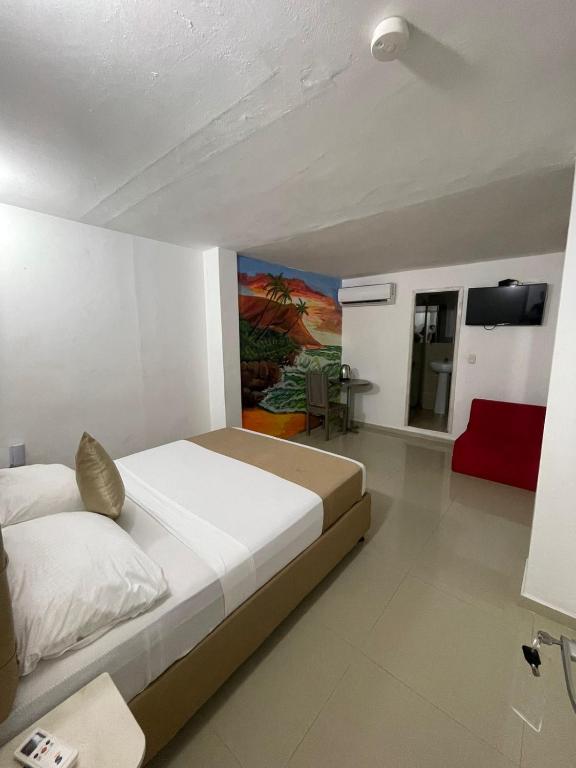 Postel nebo postele na pokoji v ubytování Hotel Hernández CTG