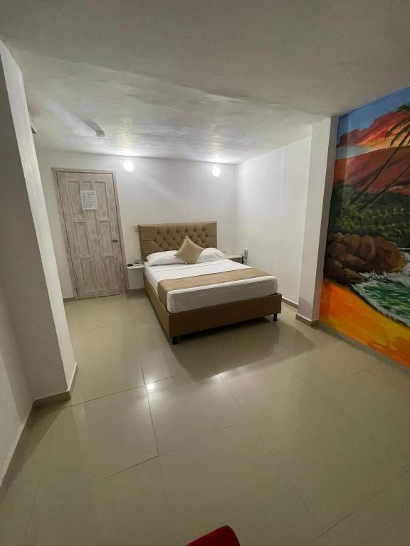 Postel nebo postele na pokoji v ubytování Hotel Hernández CTG