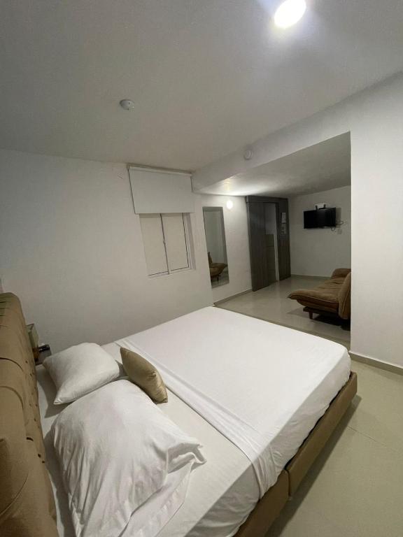 Postel nebo postele na pokoji v ubytování Hotel Hernández CTG