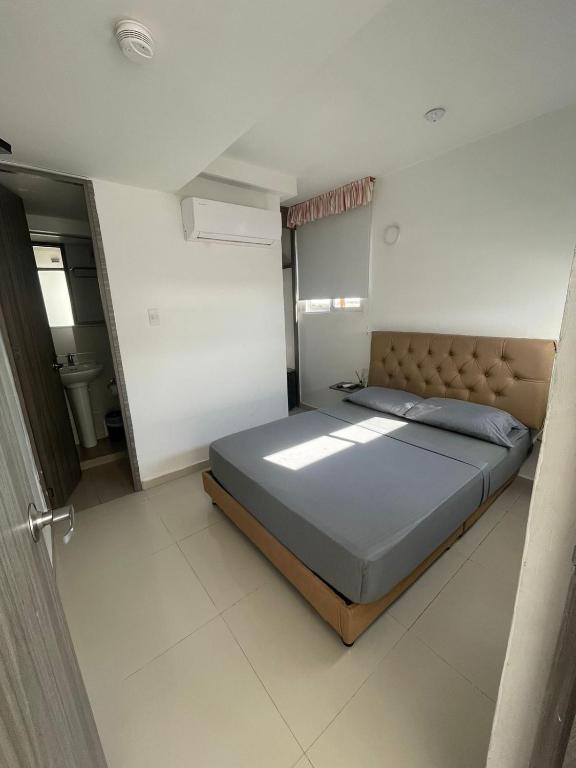 Postel nebo postele na pokoji v ubytování Hotel Hernández CTG
