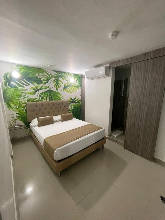 Postel nebo postele na pokoji v ubytování Hotel Hernández CTG