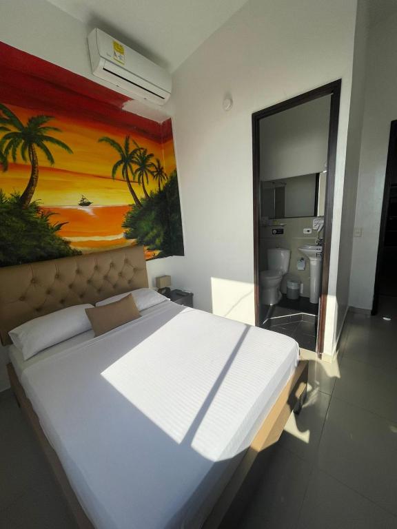 Postel nebo postele na pokoji v ubytování Hotel Hernández CTG