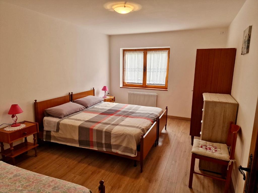 Postel nebo postele na pokoji v ubytování Chalet Nontiscordardime