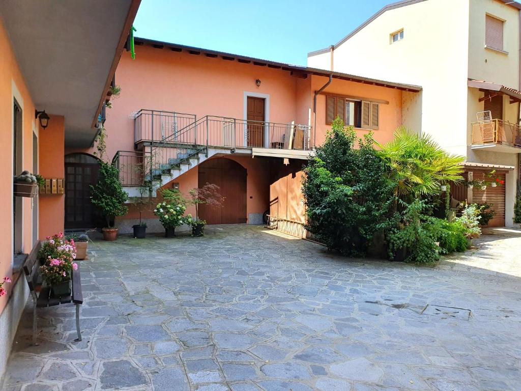 a courtyard of an apartment building with a balcony at Charming Apartment near Lake Maggiore in Luino