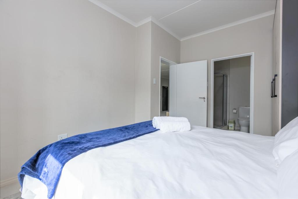 Postel nebo postele na pokoji v ubytování Smartz Apartment