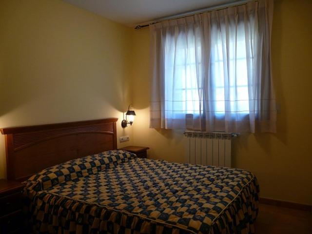 Postel nebo postele na pokoji v ubytování Complejo Turístico Bielsa Hotel y camping