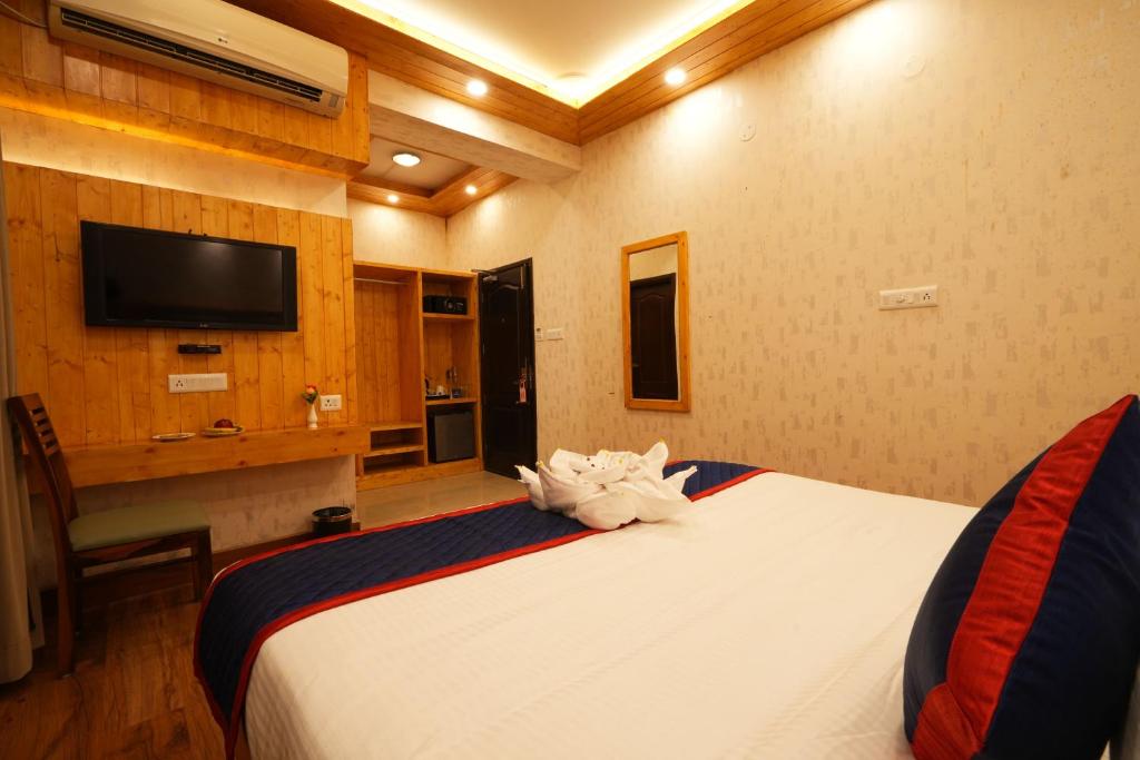 Postel nebo postele na pokoji v ubytování Zip By Spree Hotels Bella Heights Mcleodganj