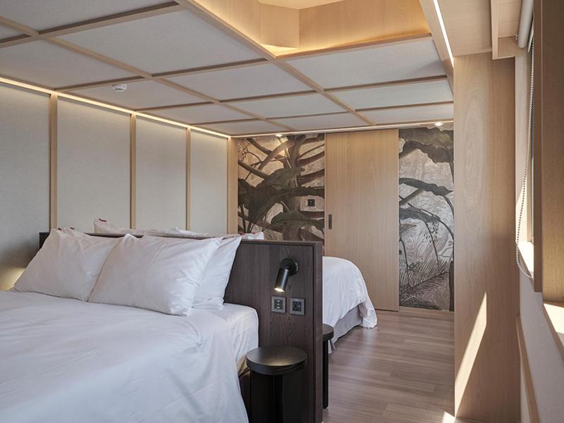Postel nebo postele na pokoji v ubytování Reddot Hotel