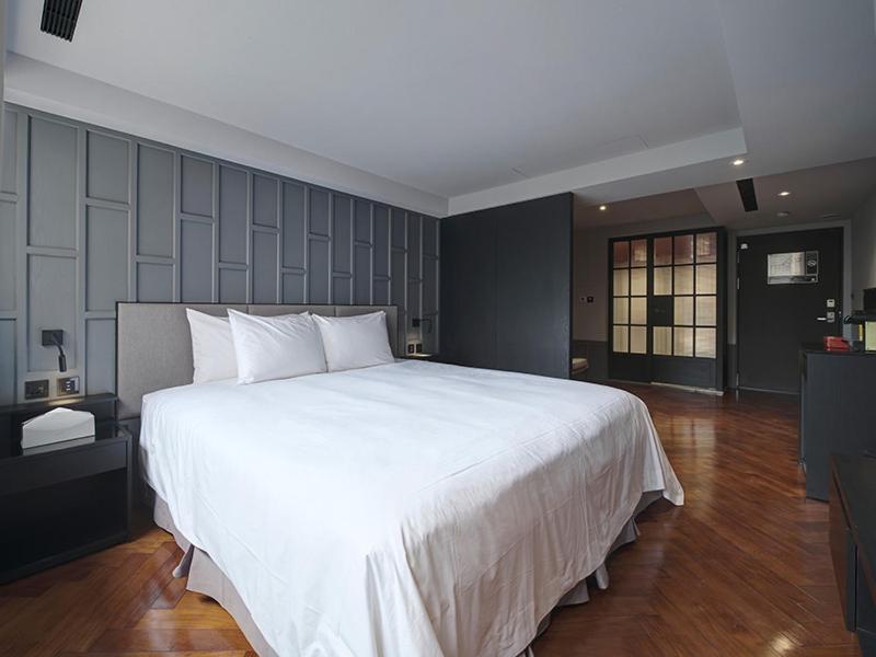 Postel nebo postele na pokoji v ubytování Reddot Hotel