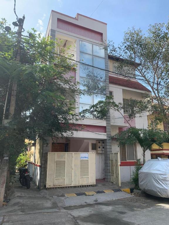 a tall building with a lot of windows at Abids Inn Homestay in Bangalore