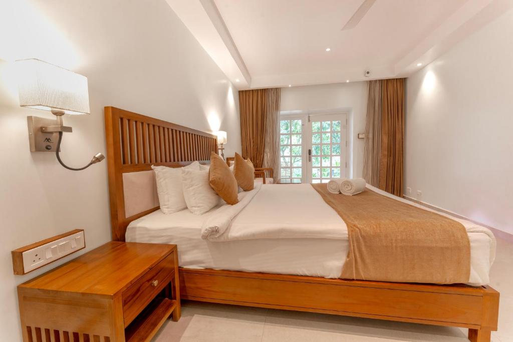 Postel nebo postele na pokoji v ubytování Le Montfort Resort