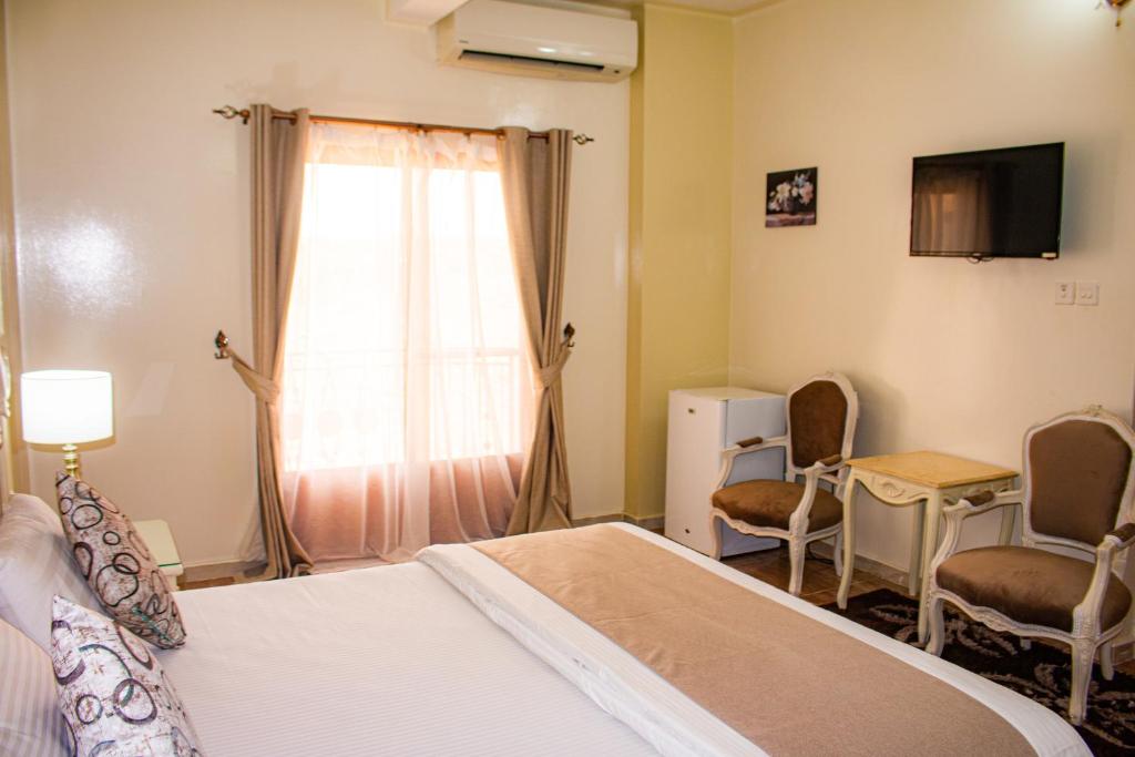 Postel nebo postele na pokoji v ubytování Riyam Hotel