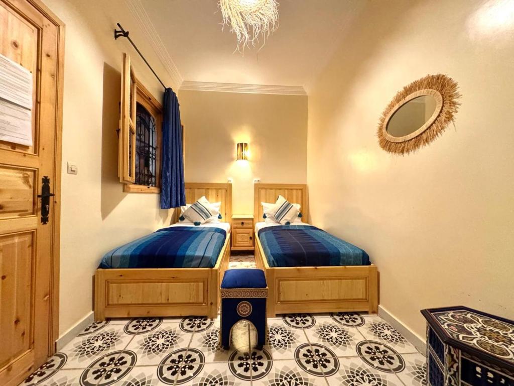 Postel nebo postele na pokoji v ubytování Riad Rayan