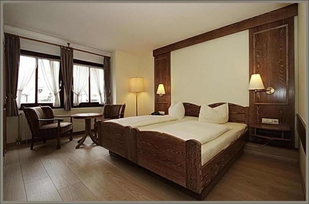 Кровать или кровати в номере Hotel Baeren