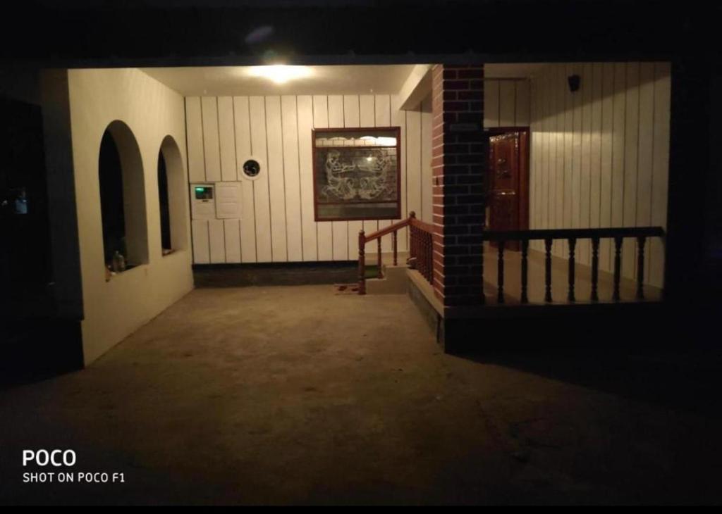 an empty hallway of a building at night at The Varkala Retreat Villa in Varkala