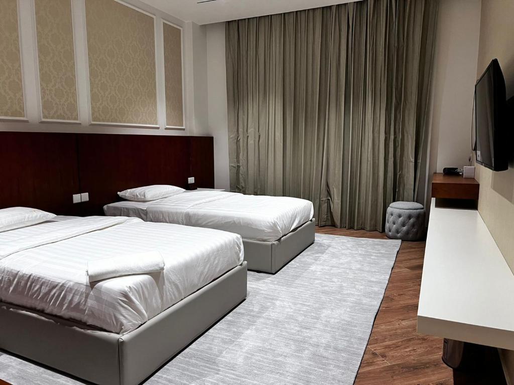Postel nebo postele na pokoji v ubytování فندق الياس - Yas Hotel
