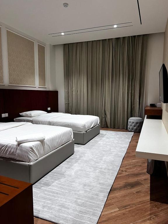 Postel nebo postele na pokoji v ubytování فندق الياس - Yas Hotel