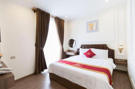 En eller flere senge i et værelse på Kim Chi An Hotel DL - by BAY LUXURY