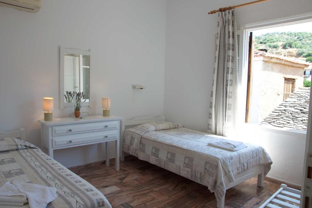 Postel nebo postele na pokoji v ubytování Mirto Apartments