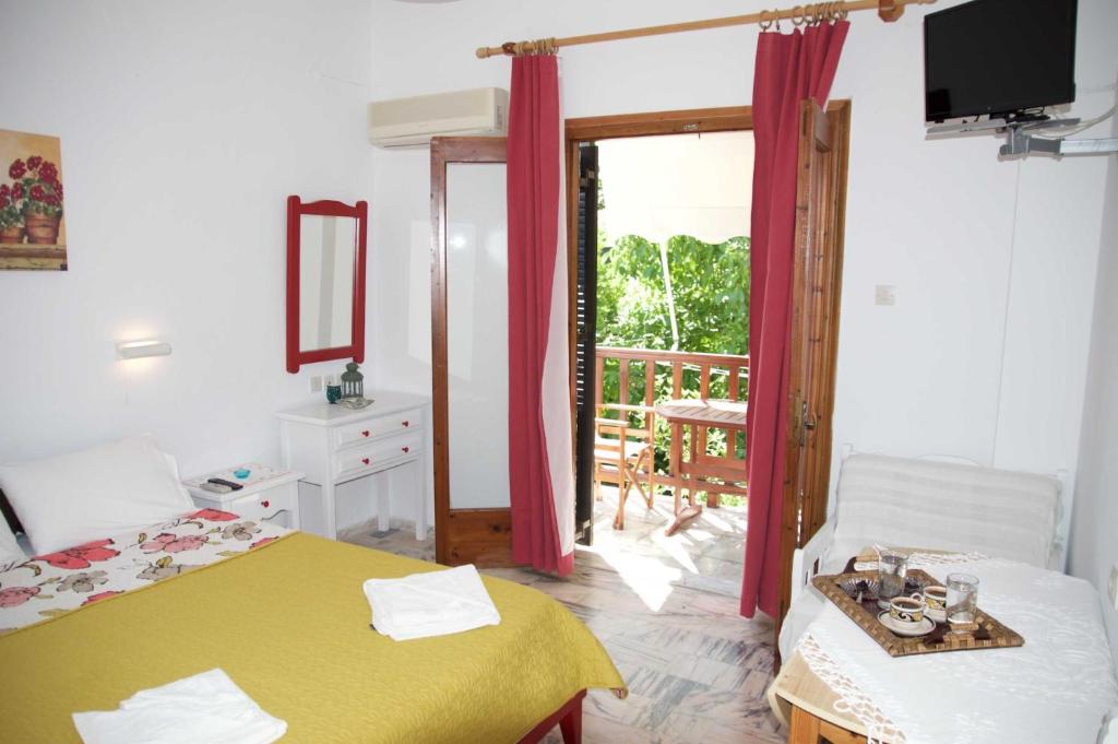 Postel nebo postele na pokoji v ubytování Mirto Apartments