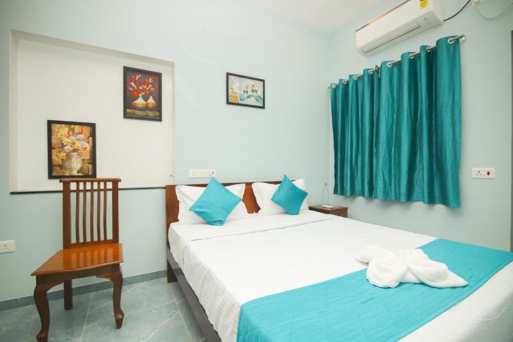 Ένα ή περισσότερα κρεβάτια σε δωμάτιο στο Sk Grand Villa, Heritage Inn