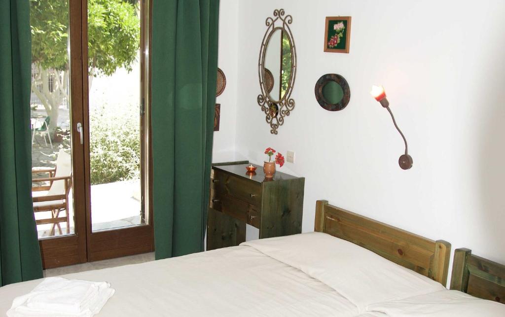 Postel nebo postele na pokoji v ubytování Mirto Apartments
