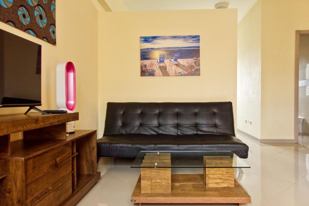 TV a/nebo společenská místnost v ubytování Praia Capital Residence Aparthotel