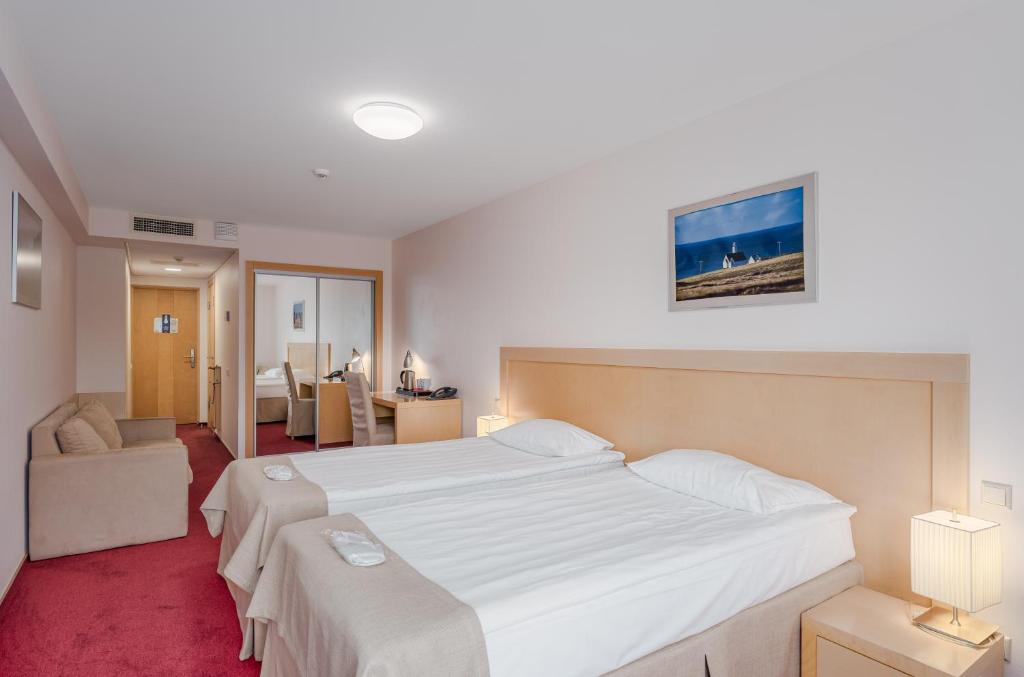Postel nebo postele na pokoji v ubytování Riga Islande Hotel with FREE Parking