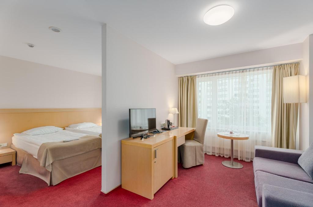 Postel nebo postele na pokoji v ubytování Riga Islande Hotel with FREE Parking