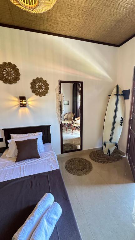 Postel nebo postele na pokoji v ubytování Kahaii Surf hotel