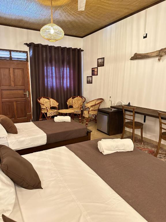 Postel nebo postele na pokoji v ubytování Kahaii Surf hotel