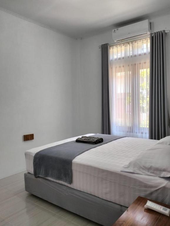 Postel nebo postele na pokoji v ubytování LilyPad guest house