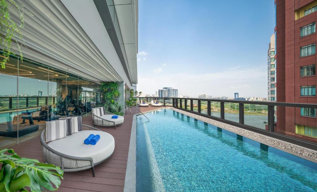 a pool on the roof of a building at Hilton Saigon in Ho Chi Minh City