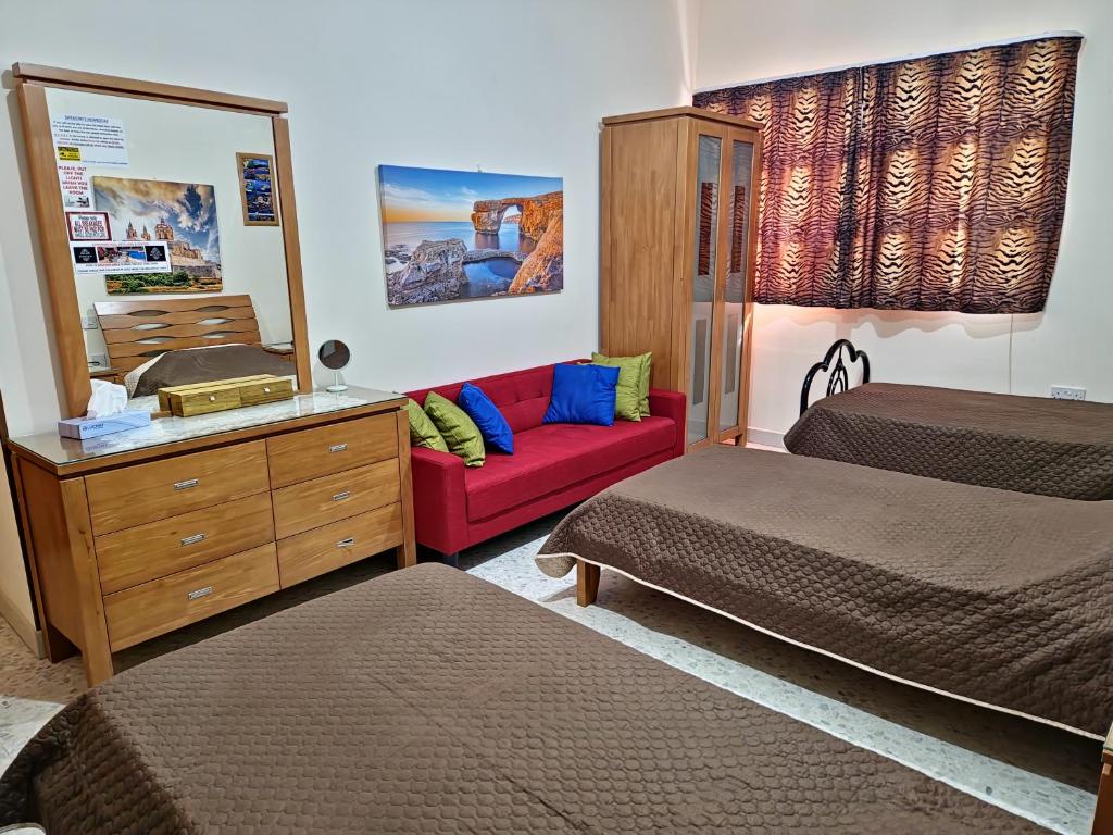 Postel nebo postele na pokoji v ubytování Saracini's Homestay