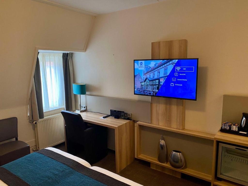 TV a/nebo společenská místnost v ubytování Best Western Hotel Baars