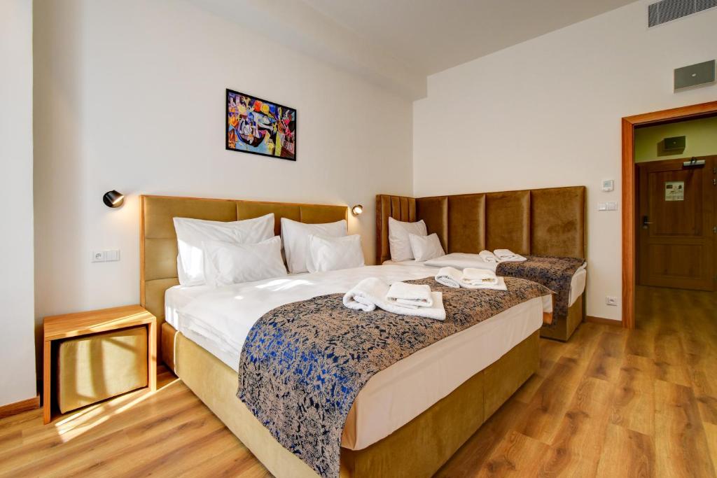 Postel nebo postele na pokoji v ubytování Hotel Karlova Prague