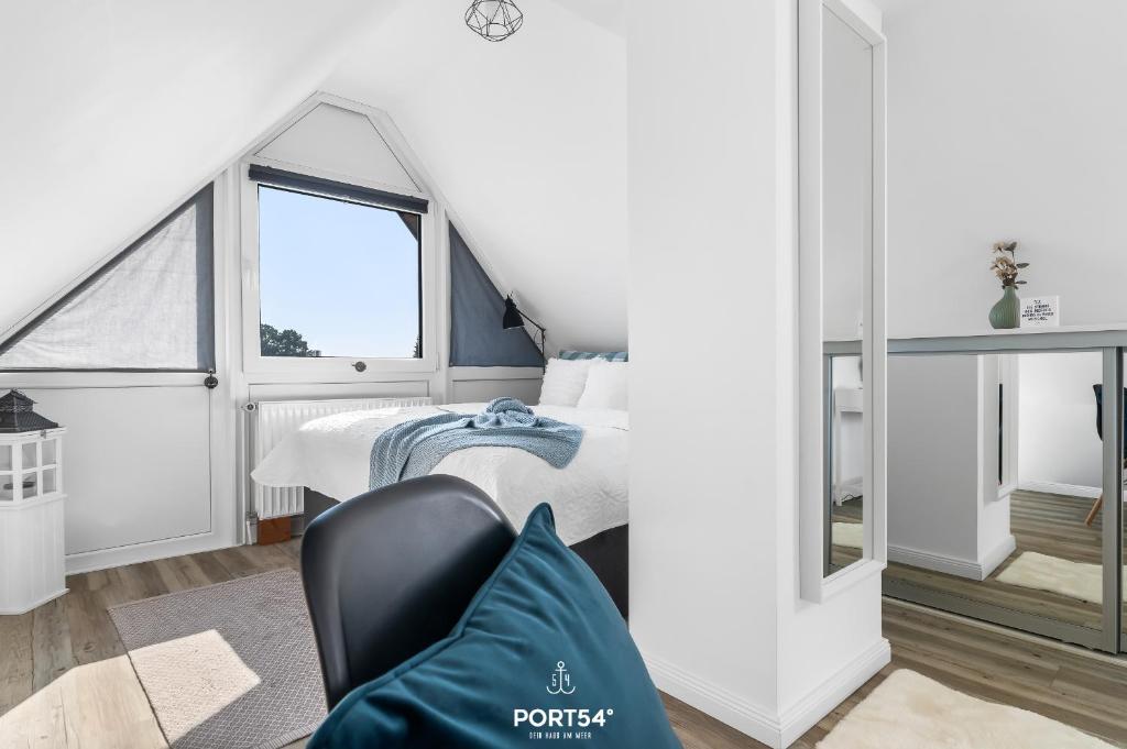 Postel nebo postele na pokoji v ubytování FW Happy Lounge Haffkrug