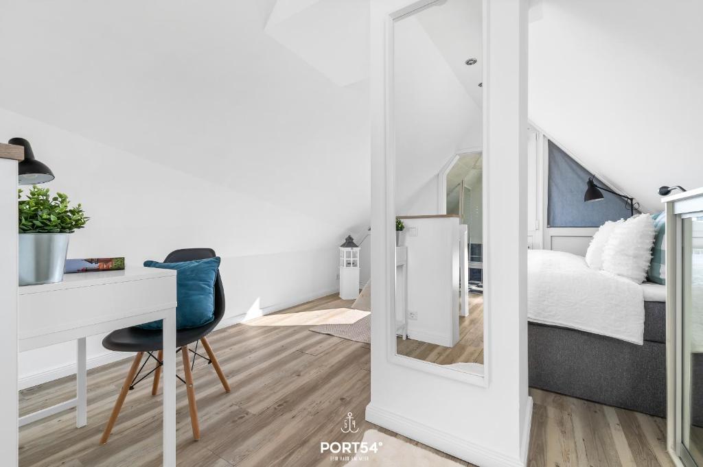 Postel nebo postele na pokoji v ubytování FW Happy Lounge Haffkrug