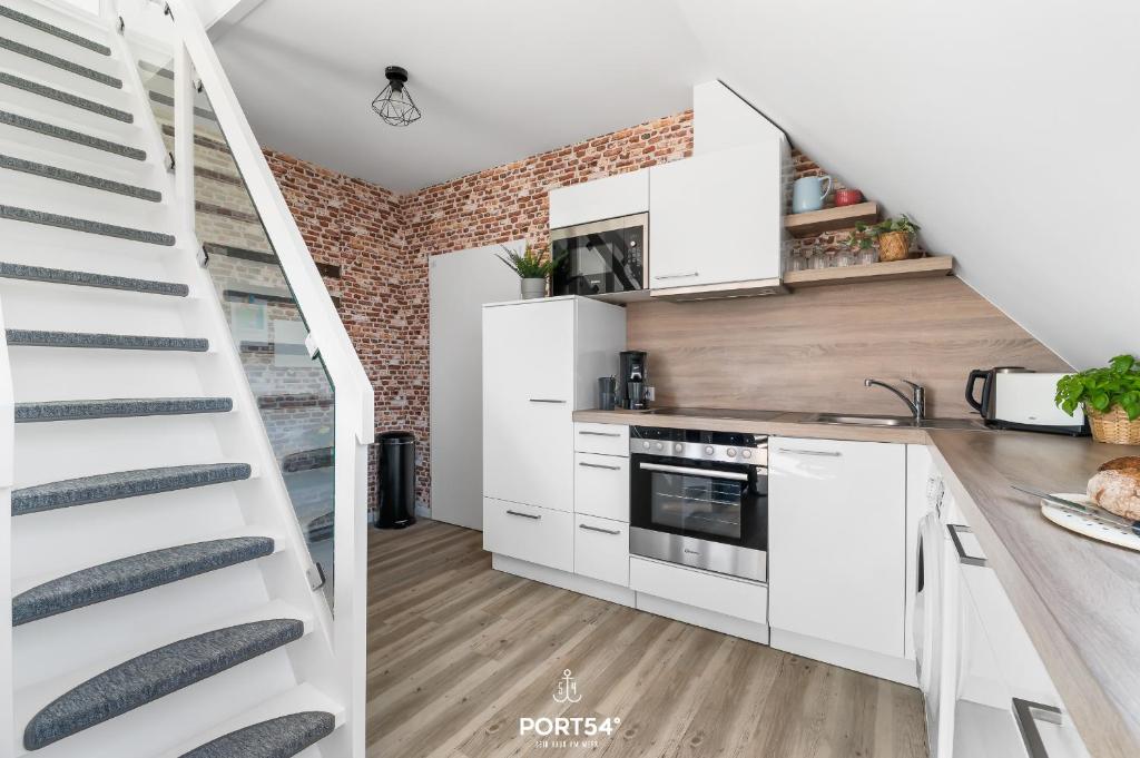 Kuchyň nebo kuchyňský kout v ubytování FW Happy Lounge Haffkrug