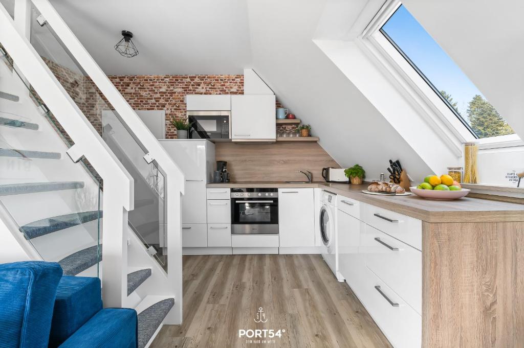 Kuchyň nebo kuchyňský kout v ubytování FW Happy Lounge Haffkrug
