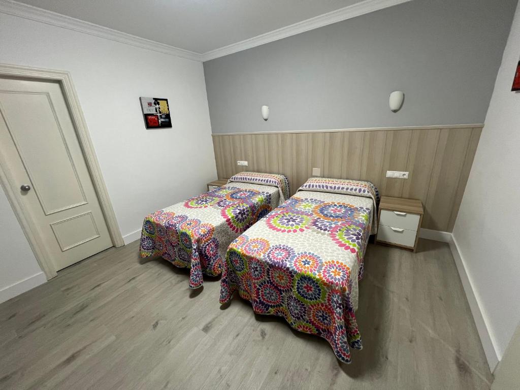Postel nebo postele na pokoji v ubytování Hotel Dila