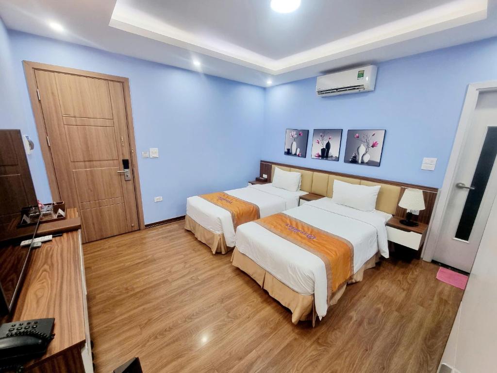Postel nebo postele na pokoji v ubytování EVEREST HOTEL