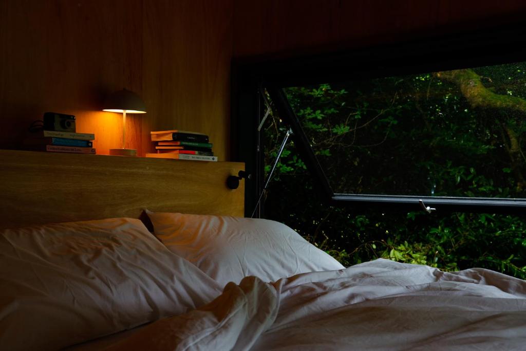 Postel nebo postele na pokoji v ubytování Samsu Cabins