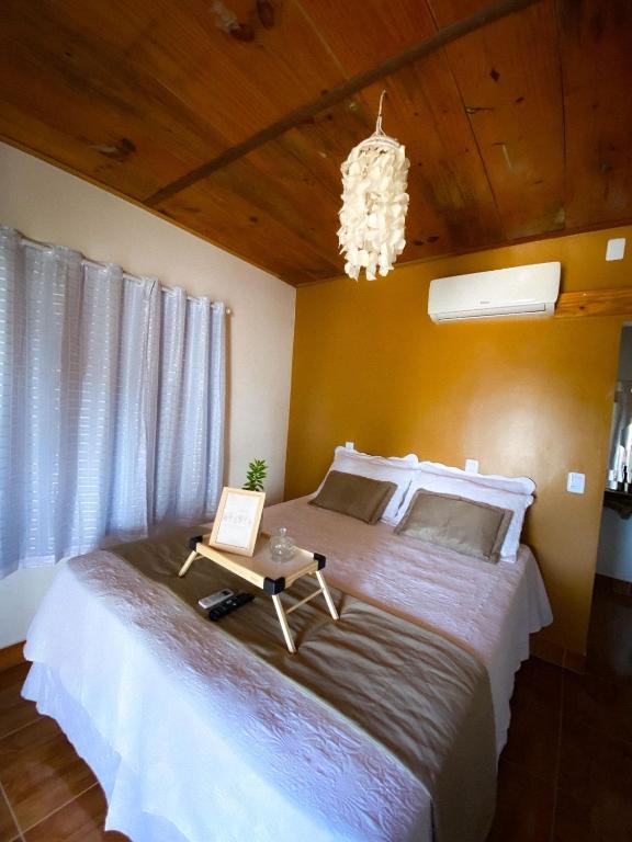 Postel nebo postele na pokoji v ubytování Chalé dos Ventos